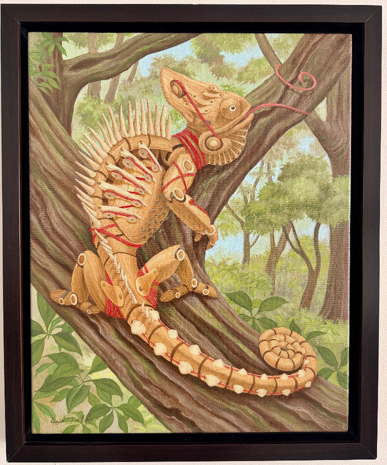 Framed artwork of a creature with lizard-like features on a tree branch