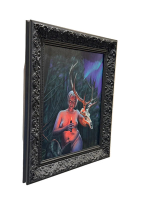 Framed artwork of a deer and human figure on a white surface