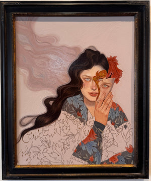 Framed artwork of a woman with a butterfly on her face against a marbled background
