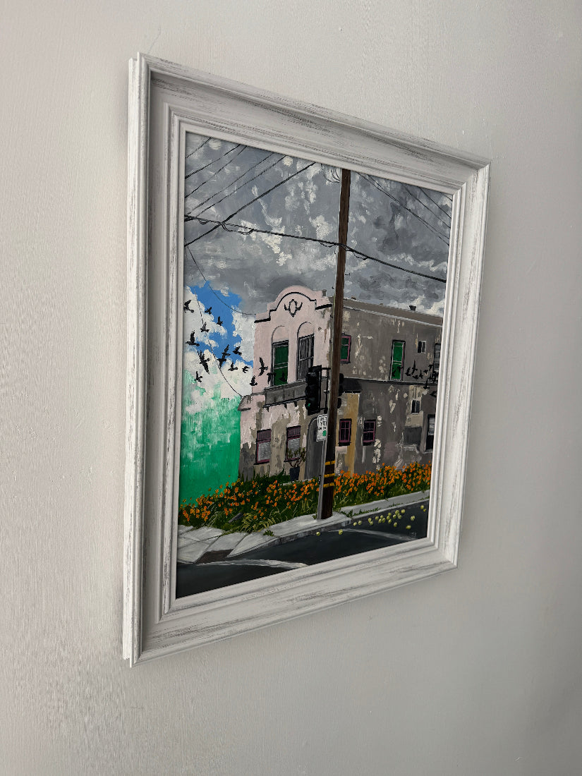 Framed artwork on a plain wall