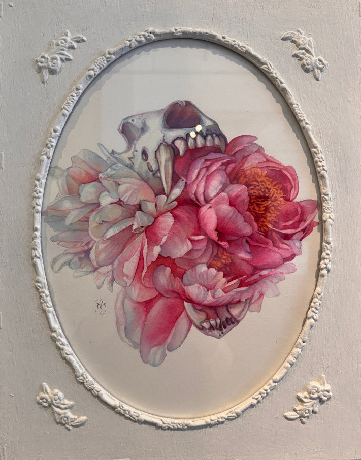 Decorative wall art with a pink flower and skull design on a gray background