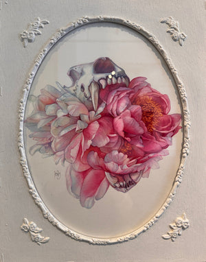 Decorative wall art with a pink flower and skull design on a gray background