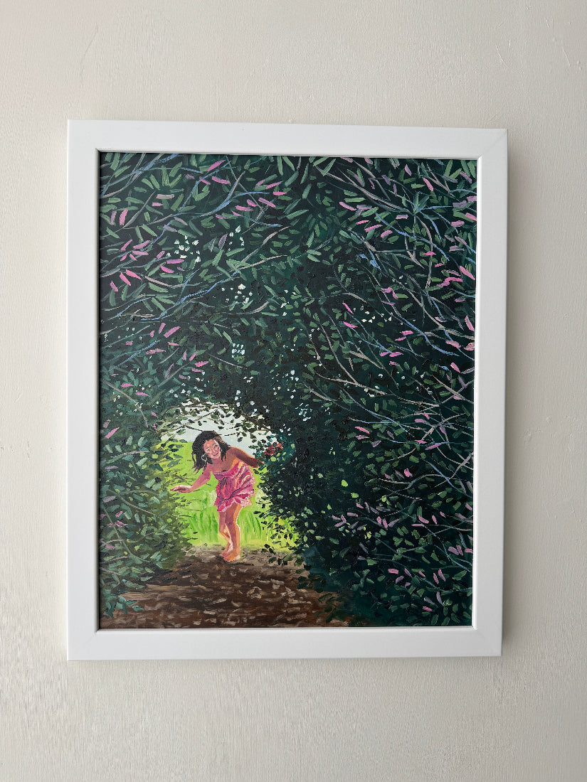 Framed artwork of a woman walking under a tree with leaves and flowers.