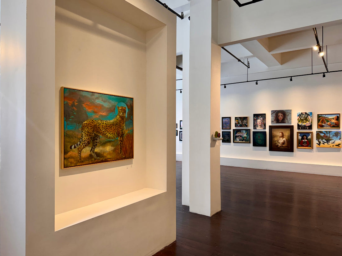 Art gallery with various paintings on the walls
