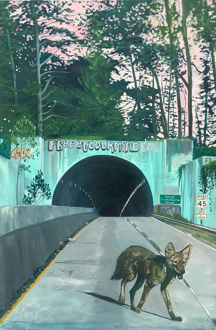 Coyote standing on a road leading to a tunnel with 'Free Your Mind' sign