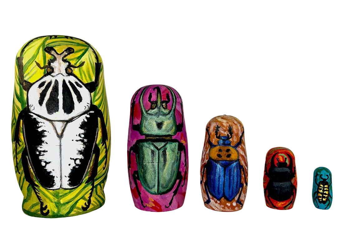 Set of colorful beetle-themed nesting dolls on a white background