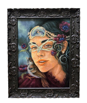 Artistic portrait of a person with decorative headpiece and flowers, framed in ornate black frame.