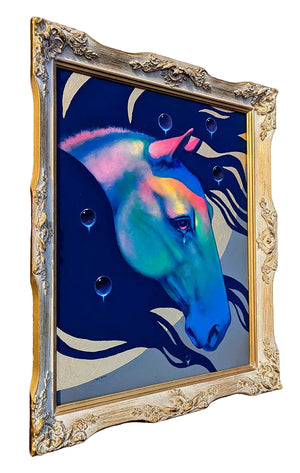 Colorful horse painting in a decorative gold frame against a natural background
