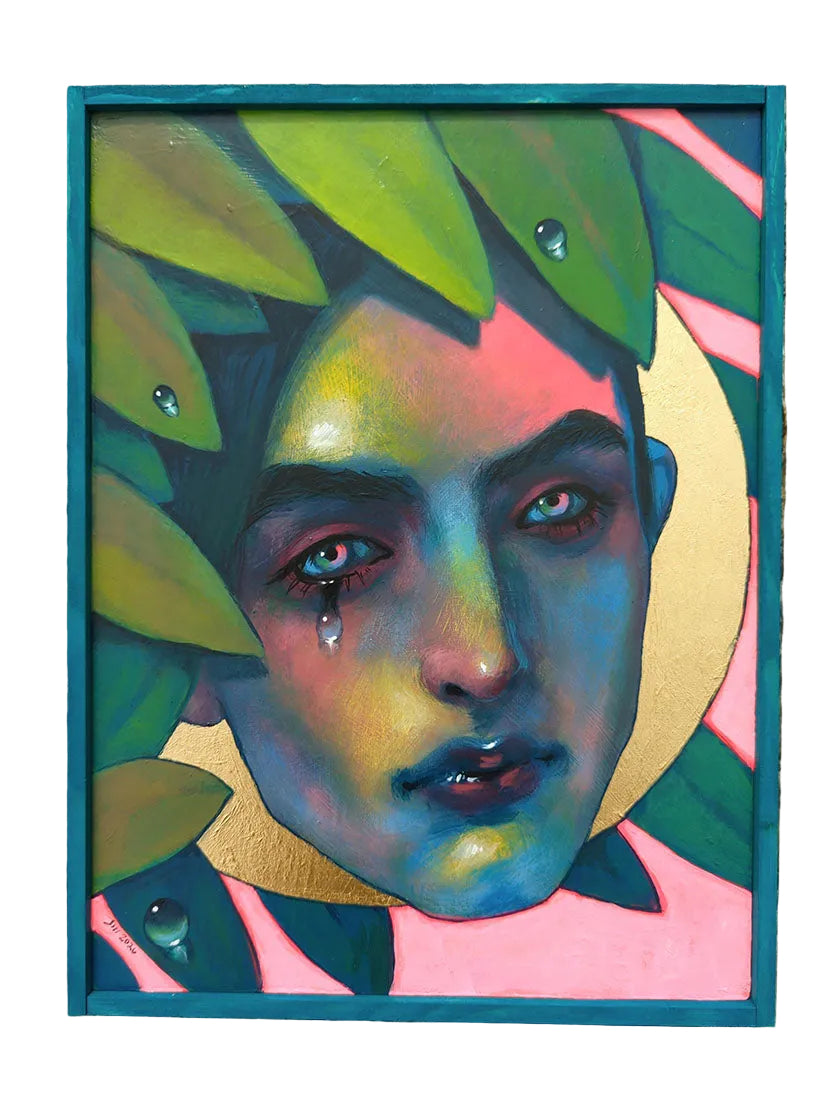 Colorful artwork of a face with leaves on a wooden surface