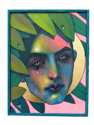 Colorful artwork of a face with leaves on a wooden surface