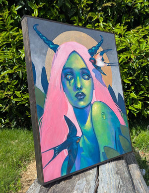 Colorful painting of a figure with pink hair and birds on a wooden surface outdoors.