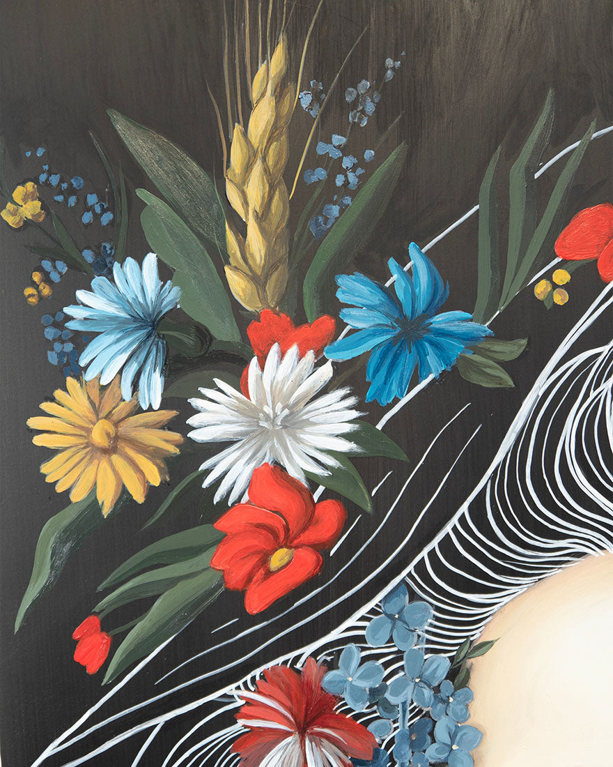 Colorful floral arrangement with red, blue, yellow, and white flowers on a dark background.