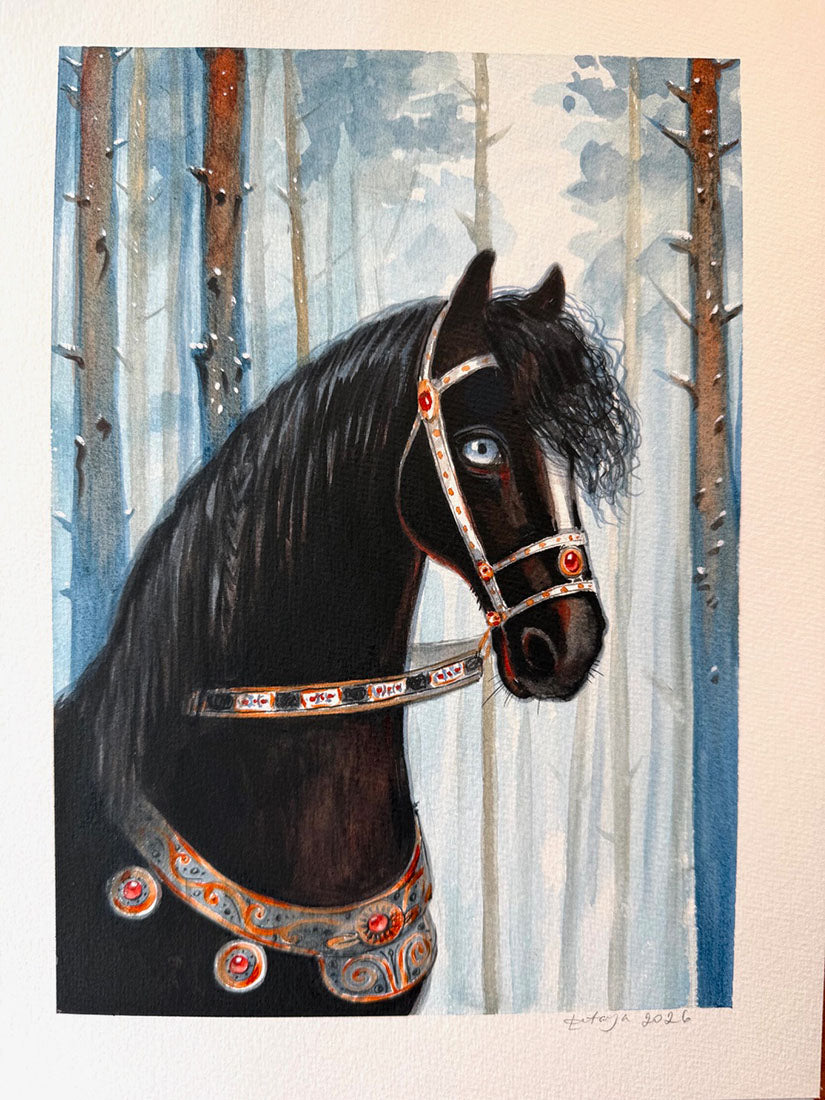 Black horse with ornate bridle in a forest setting