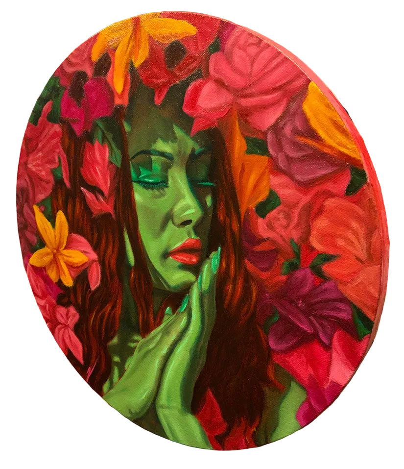 Colorful painting of a woman's face surrounded by flowers on an easel.