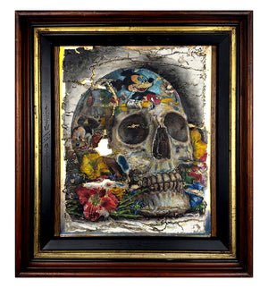 Framed artwork of a skull with colorful elements and a dark background