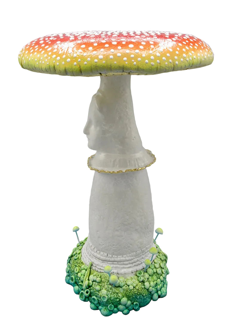 Mushroom-shaped sculpture with colorful cap and detailed stem on a gray background