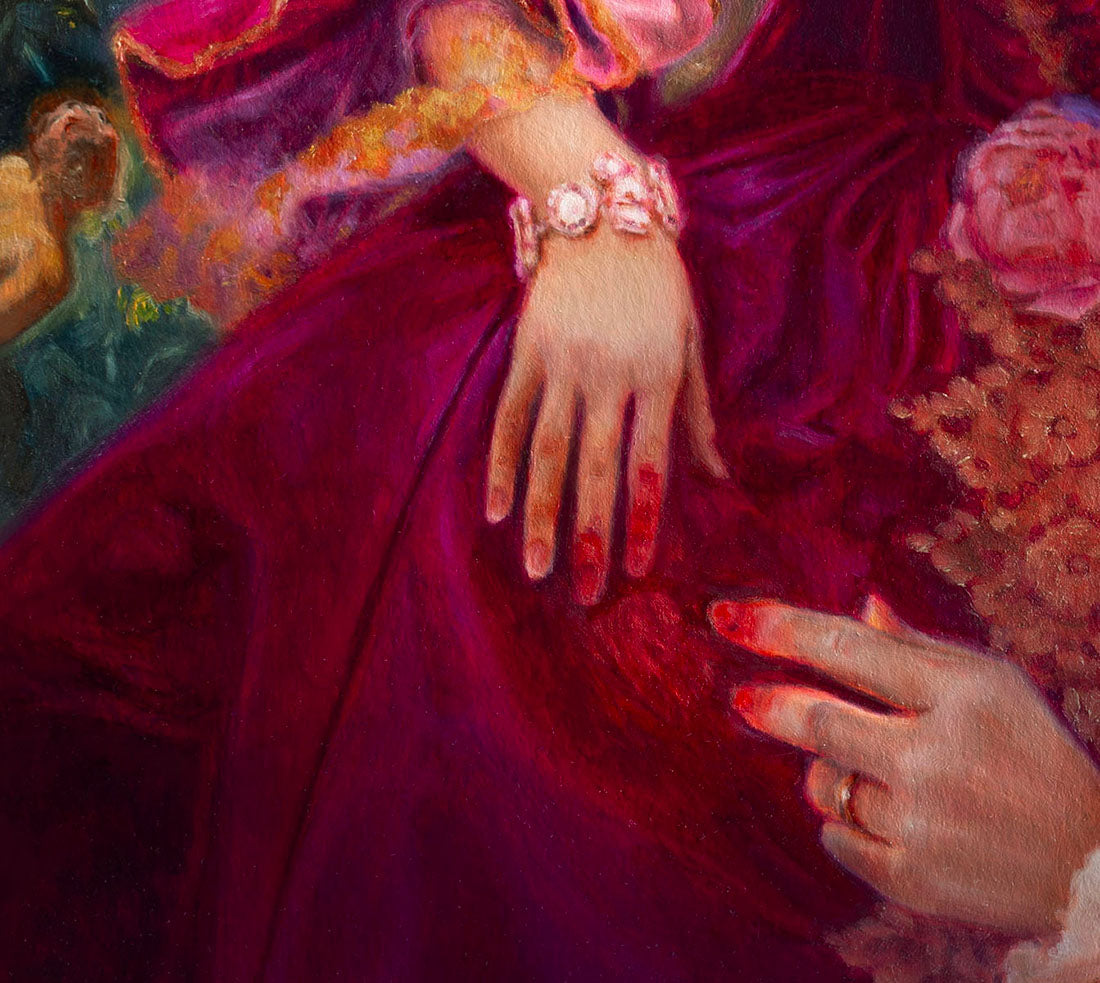 Close-up of a hand with a ring on a purple fabric background