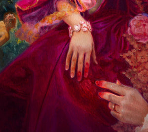 Close-up of a hand with a ring on a purple fabric background