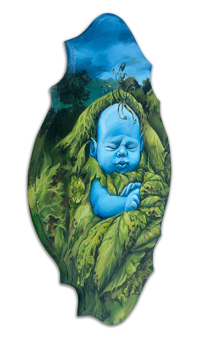 Blue baby surrounded by green leaves on a white background