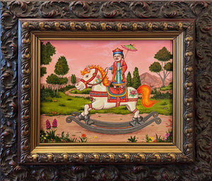Decorative painting of a person on a rocking horse with a detailed ornate frame.