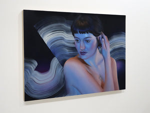 A rectangular wall art print or painting hanging on a white wall, depicting a woman with short dark hair against abstract swirling black, blue, and white forms.