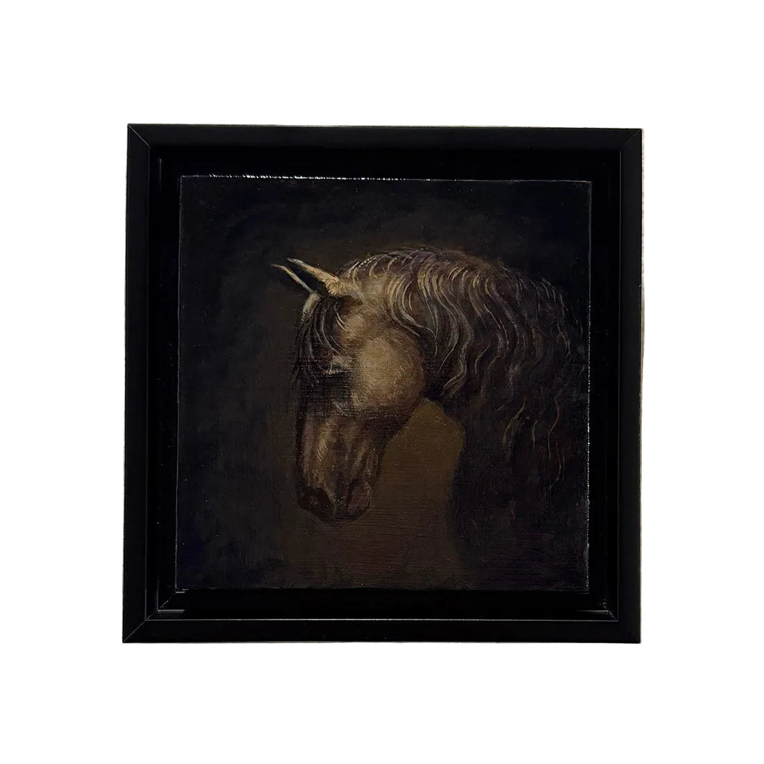 Framed painting of a horse's head on a textured wall
