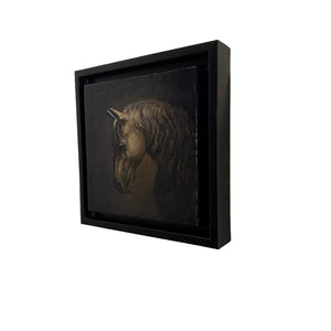 Framed artwork of a horse's head on a textured wall