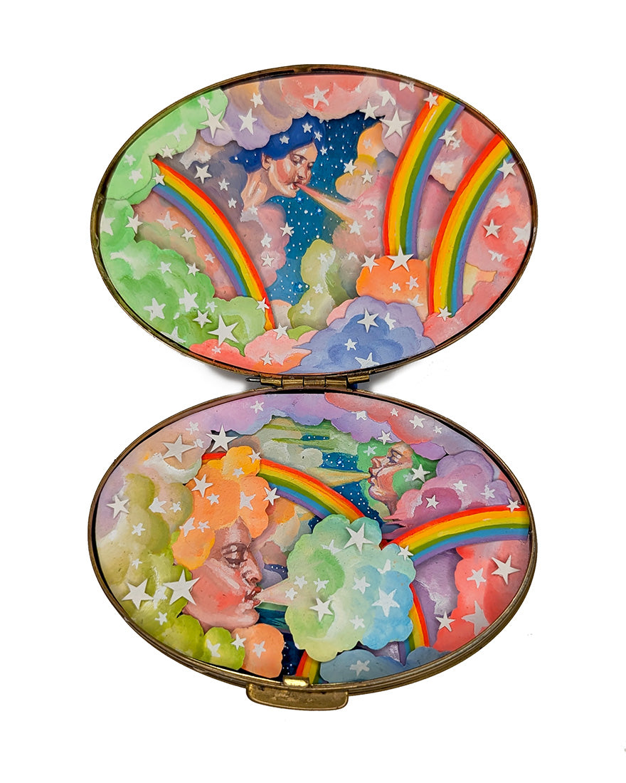 Colorful compact mirror with fairy design on a white background
