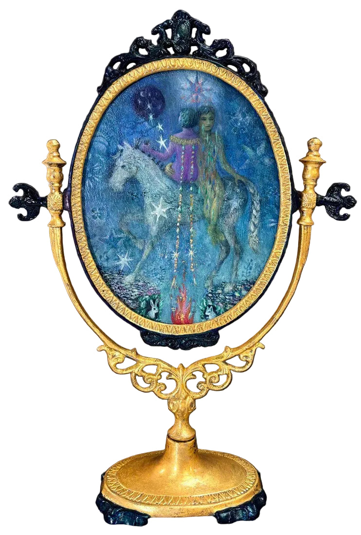 Decorative object with a figure on a horse inside an ornate frame against a dark background