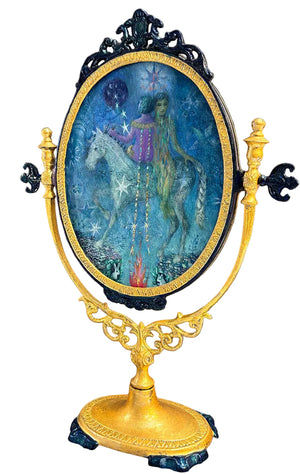 Decorative mirror with artistic depiction of a person on a horse in an ornate frame.