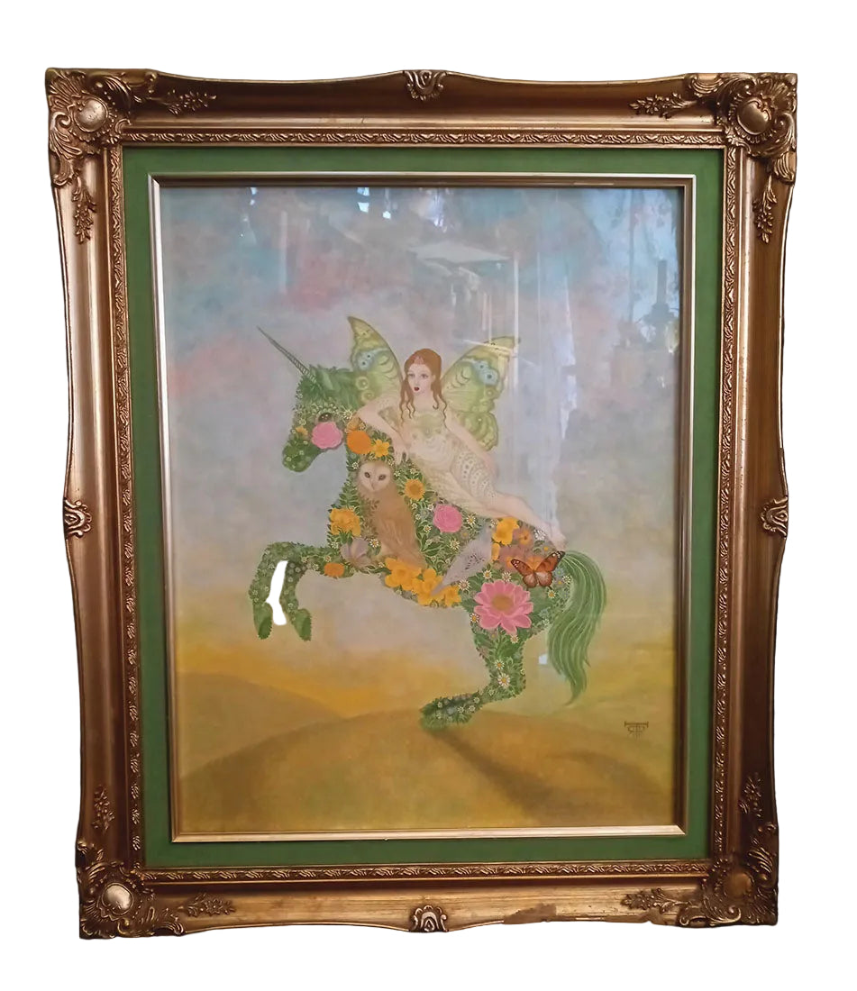 Framed artwork of a fairy riding a unicorn with flowers, on a dark background