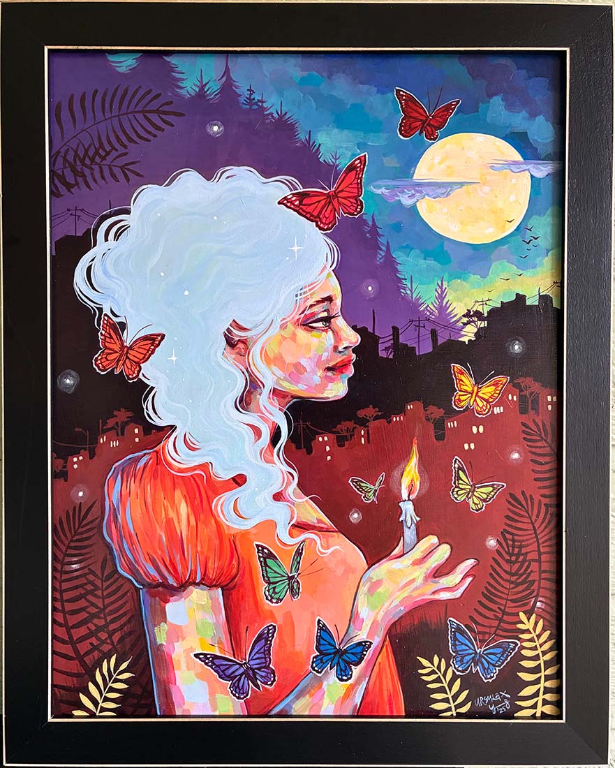 Framed artwork of a woman with butterflies and a candle against a colorful night sky.