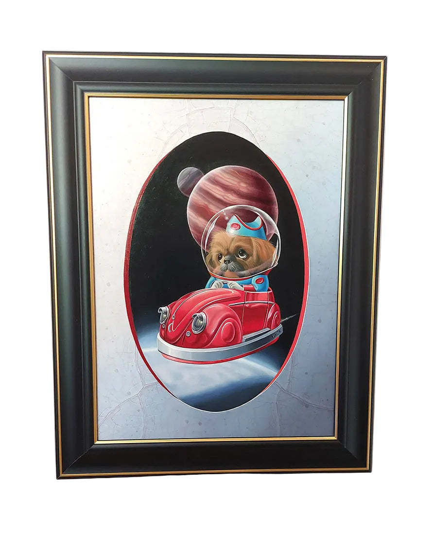 A framed painting featuring a small dog dressed as an astronaut driving a red car in space, mounted on a light-colored wall.