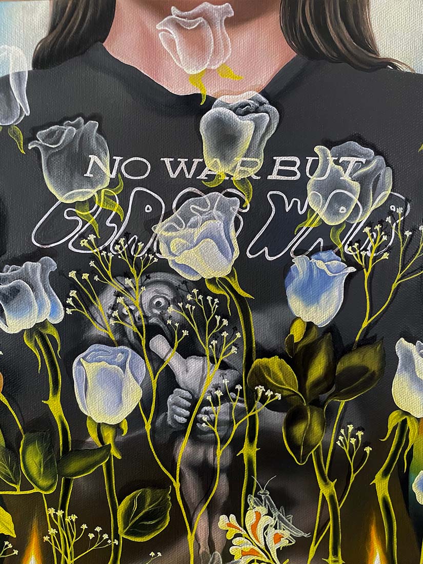 Black t-shirt with floral design and text 'No War But Class War on a dark background