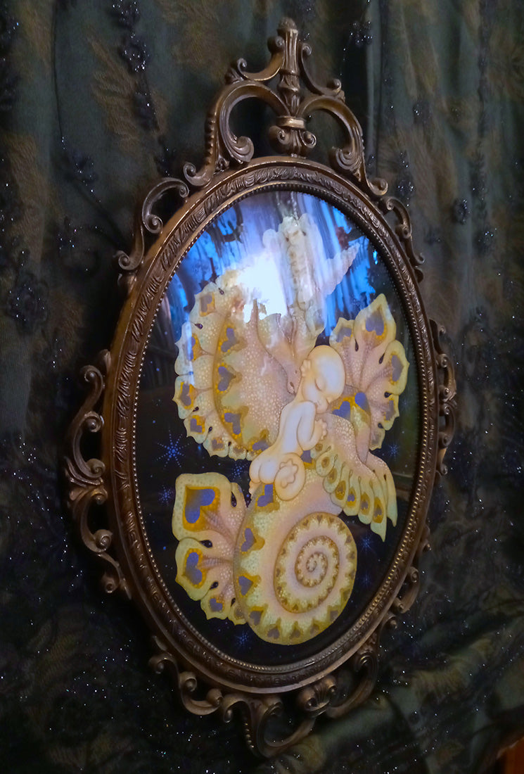 Decorative mirror with intricate design and gold frame on a textured dark background