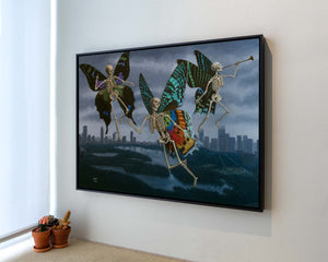 Sandra Yagi painting of 3 skeletons with butterfly wings flying over New York City hanging on a wall.